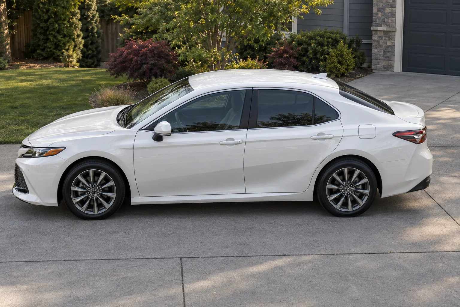 A white Toyota Camry with every window tinted to Washington’s 24% limit