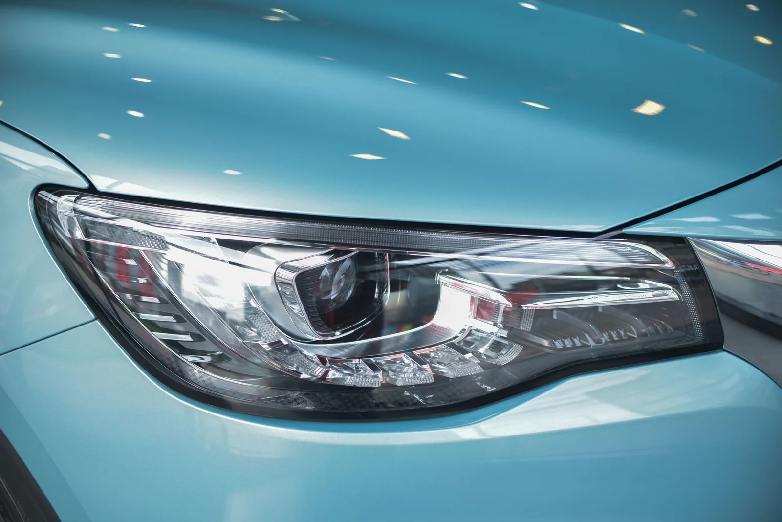 A clear modern car headlight up close
