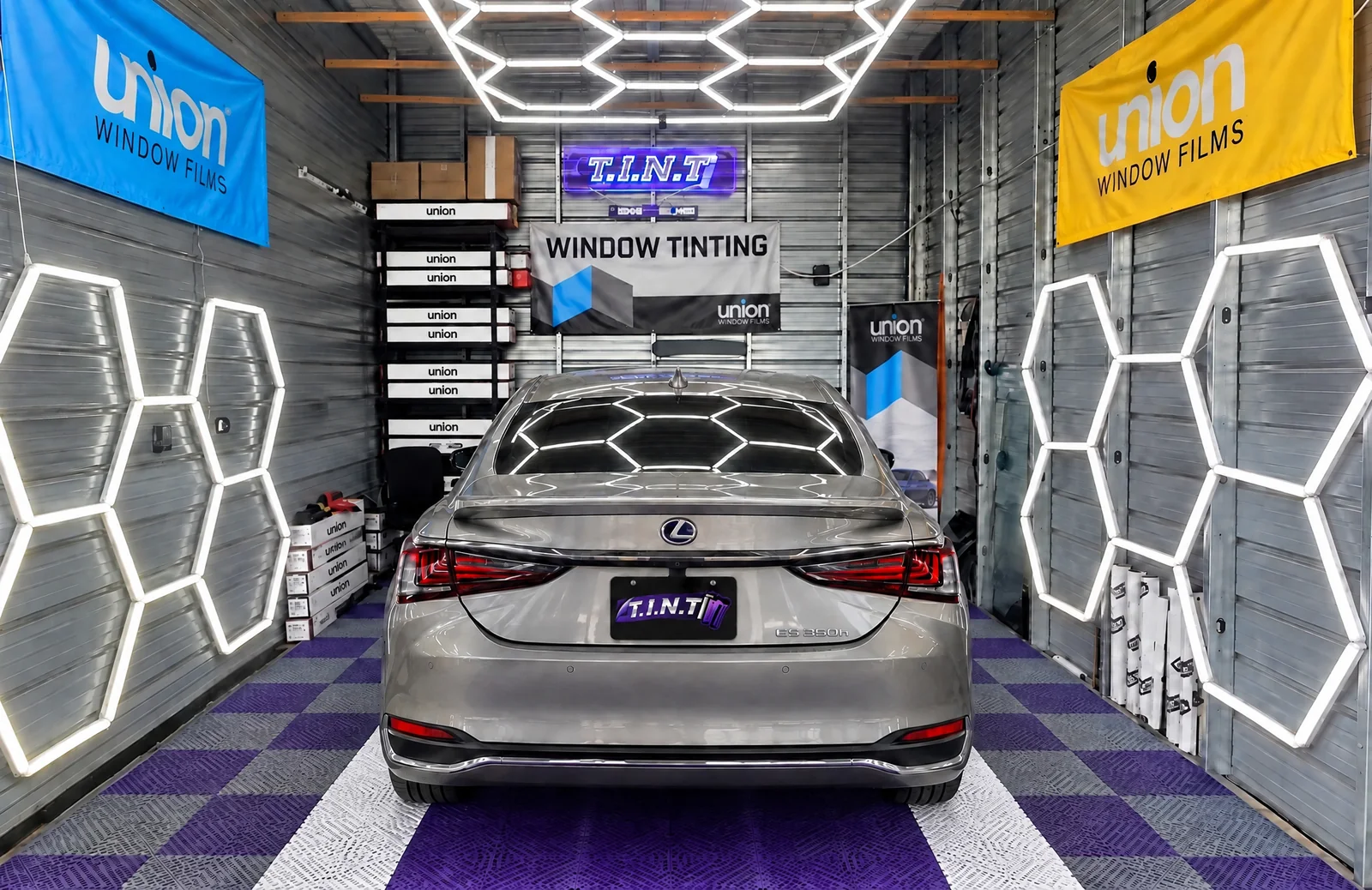 A silver Lexus ES in the T.I.N.T bay with its windows tinted